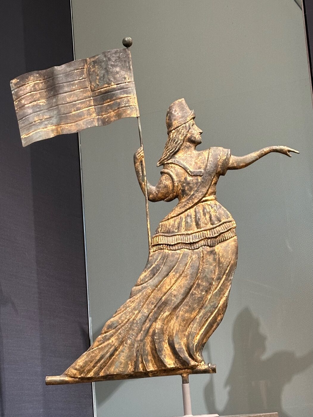 A gilded American folk-art weathervane in the shape of a draped figure at the Museum of Fine Arts, Boston.