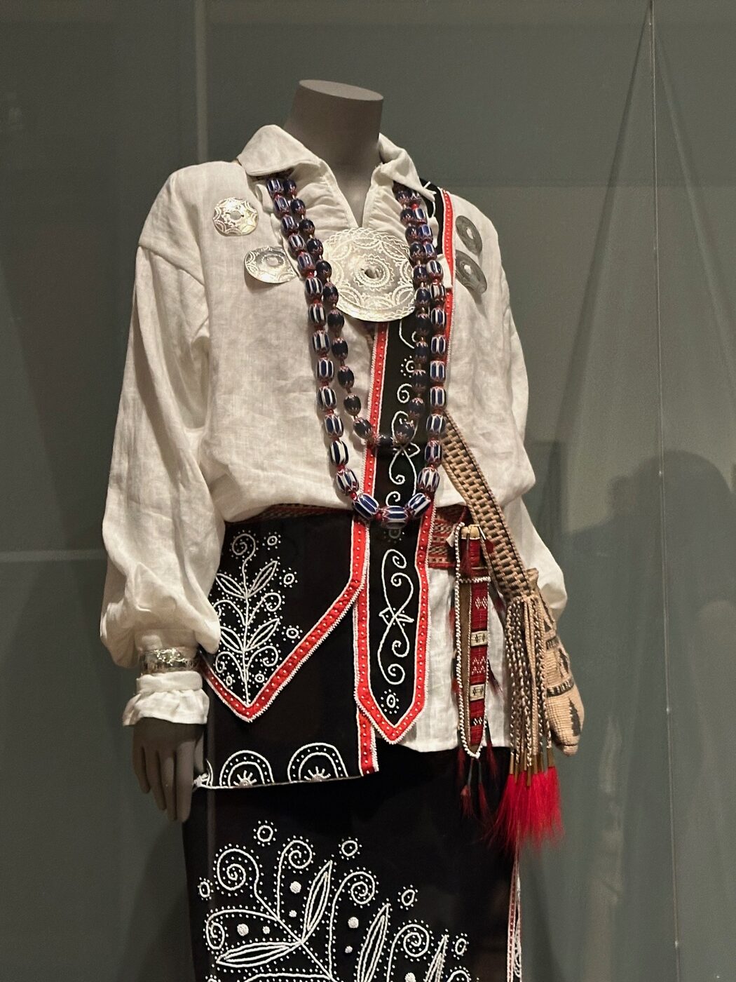 A vitrine of period American garments, an embroidered jacket and skirt, at the Museum of Fine Arts, Boston.