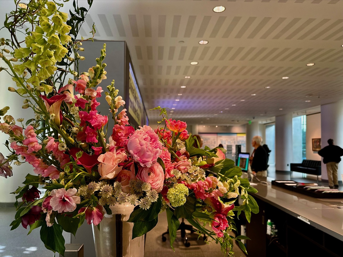 A tall floral arrangement in the lobby of the Museum of Fine Arts, Boston, during Art in Bloom.