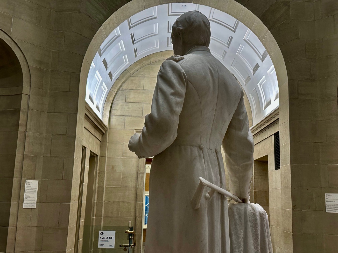 Franklin Simmons's marble statue of Ulysses S. Grant, seen from behind beneath a coffered arch at the Portland Museum of Art.
