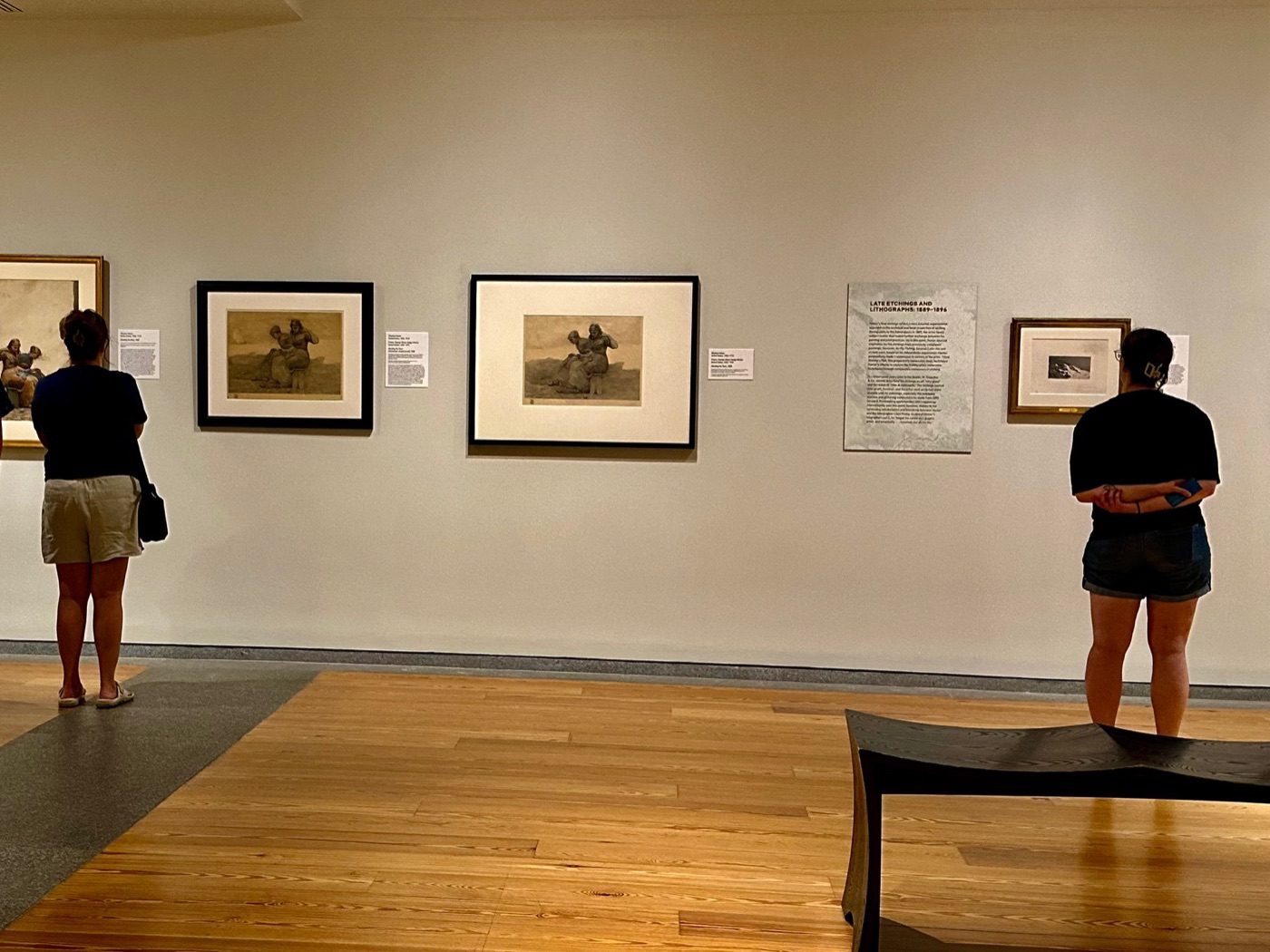 Visitors among the late etchings and lithographs in Winslow Homer, Painter/Etcher at the Portland Museum of Art.