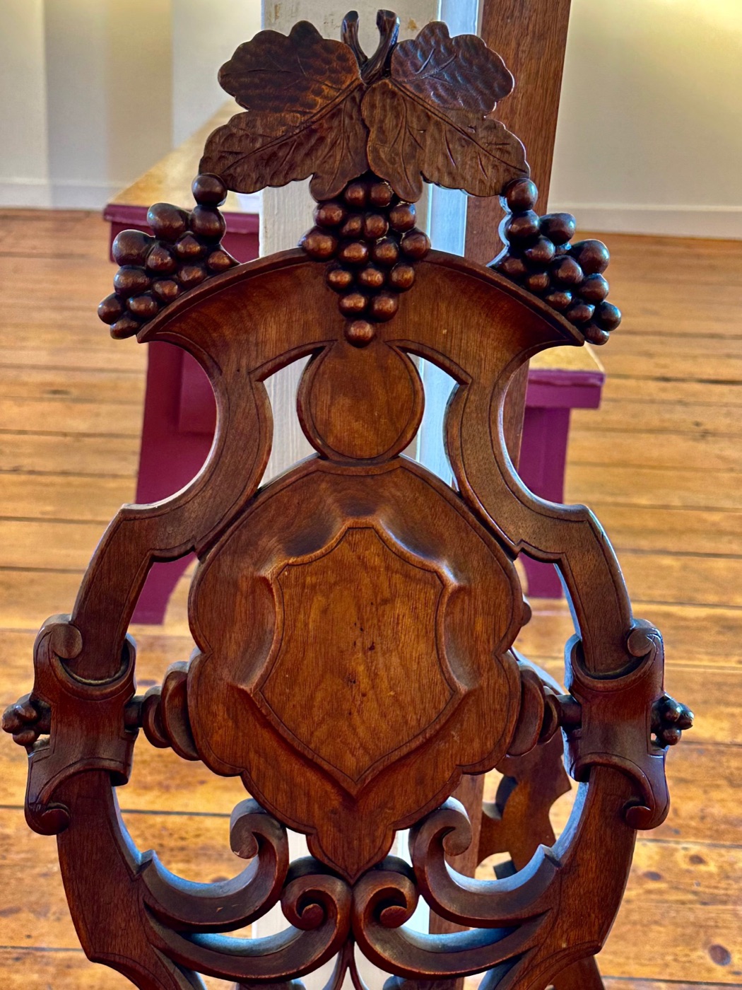 An ornately carved Victorian chairback on display at the Rockport Art Association, Rockport, Massachusetts.