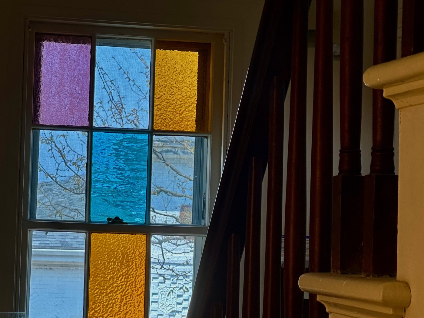 Afternoon light through a stained-glass stair window at the Rockport Art Association, Rockport.