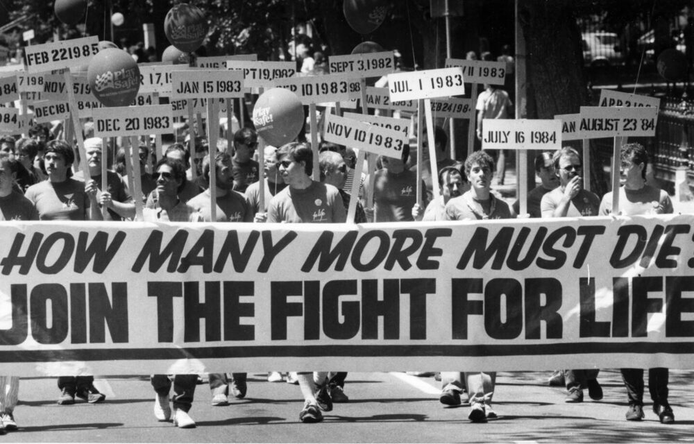 The AIDS Action Committee marching with a banner in a Boston Pride parade, 1985